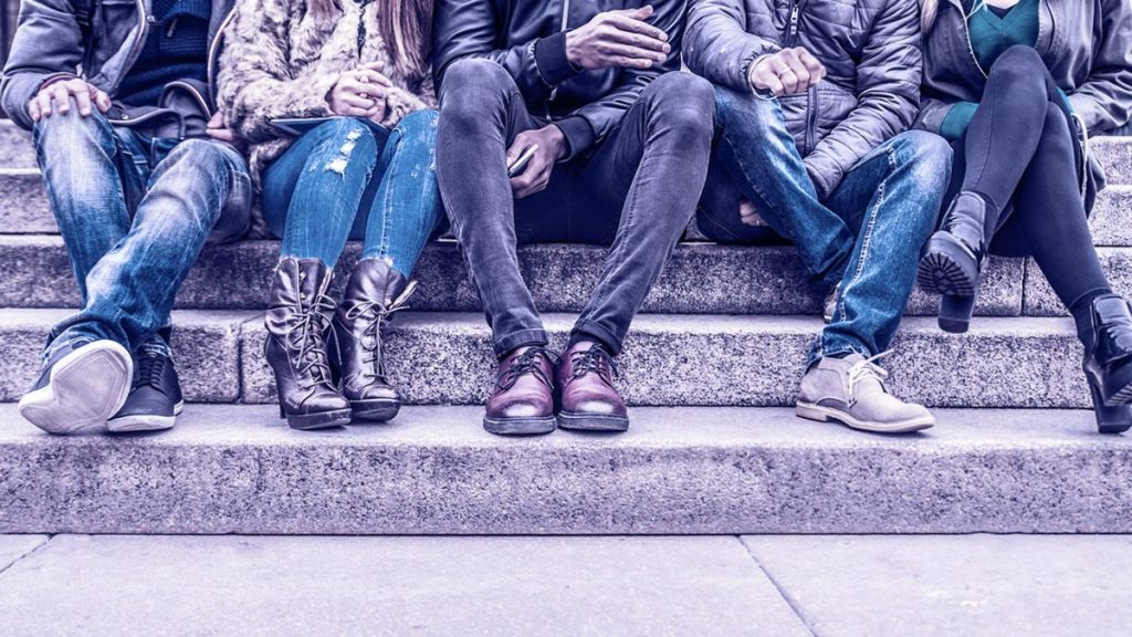 group sitting outside an outpatient treatment center