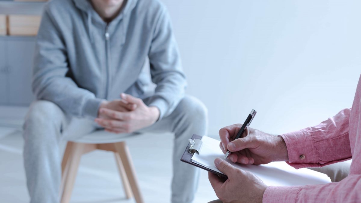 man working with a therapist on creating a relapse prevention plan