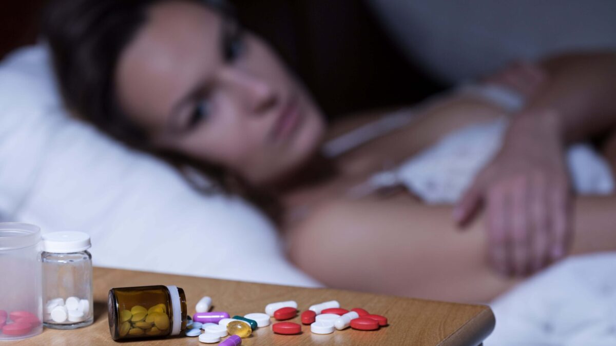 woman with insomnia addicted to sleeping pills