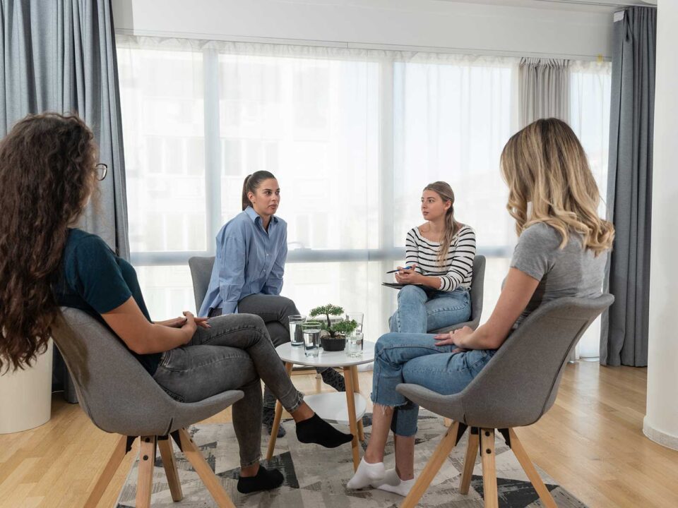 Women gather in group therapy at a womens addiction treatment in Wakefield, MA