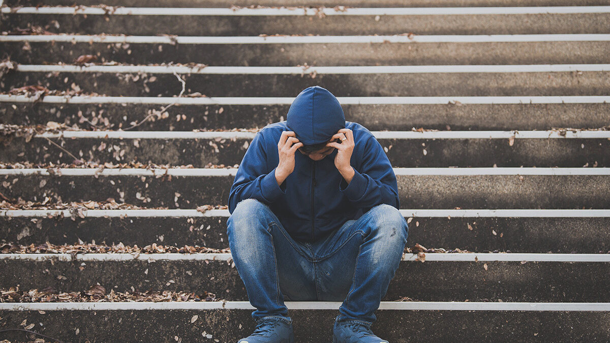 Man hides head in hoodie as he struggles with meth abuse